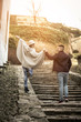 © liderina - Happy couple outdoor. Couple walking on the stairs. From behind.