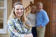 © highwaystarz - Portrait Of Young Woman With Parents At Home