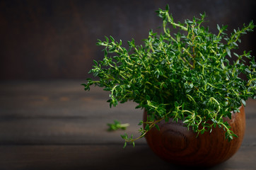 Wall Mural - Fresh thyme on wooden background, selective focus, copy space