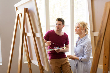 Sticker - artists with palette and easel at art school