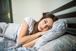 © F8  \ Suport Ukraine - Close up portrait of a calm young pretty woman sleeping and hugging pillow in bed