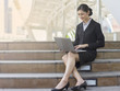 © Nattapong - businesswoman working outdoor