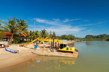 Yellow Excavator In Harbor, Thailand