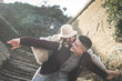 © liderina - Happy couple outdoor. Boyfriend carrying his girlfriend on piggyback.