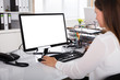 © Andrey Popov - Businesswoman Working On Computer