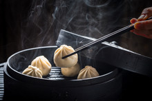 Yummy And Hot Chinese Dumplings On Black Background