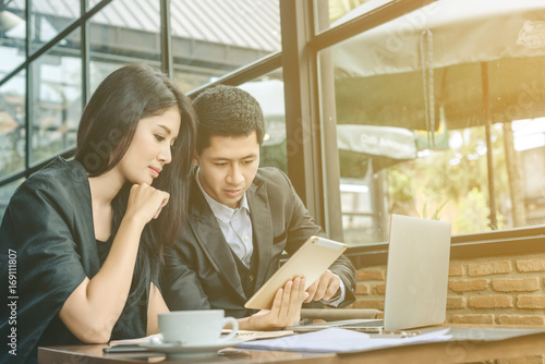 Business Couple Work With Laptop Together At Cafe Young Couple Sitting At Cafe And Looking At Laptop Business People Concept Happy Creative Team Talking In Modern Office Selective Focus Buy