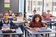 © Monkey Business - Portrait of elementary school pupils sitting at their desks