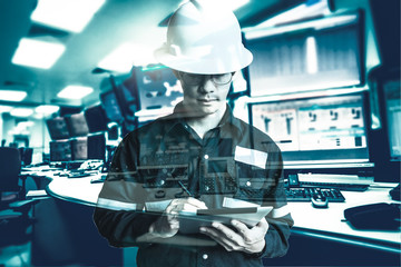 Double exposure of  Engineer or Technician man in working shirt  working with tablet in control room of oil and gas platform or plant industrial for monitor process, business and industry concept