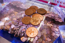 Two-pence Coins Lie On The Glass On Top Of A 2p Nudger Machine In A Seaside Amusement Arcade.