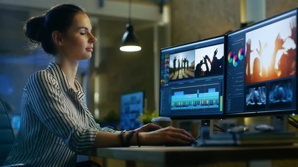 Wall Mural - female video editor works with footage and sound on her personal computer. her office is modern and 