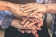 © Fluky - Business people and architects join hands for teamwork and unity and sustainability.