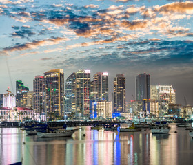 Sticker - San Diego, California. Night view of Downtown buildgs with water reflections