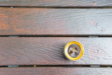 top view. flat lay of espresso coffee in transparent cup on wooden floor. copy space for text