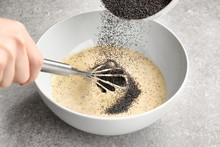 Chef Preparing Dough With Poppy Seeds On Kitchen Table