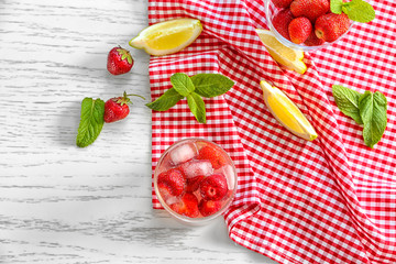 Wall Mural - Composition with delicious strawberry lemonade on light table