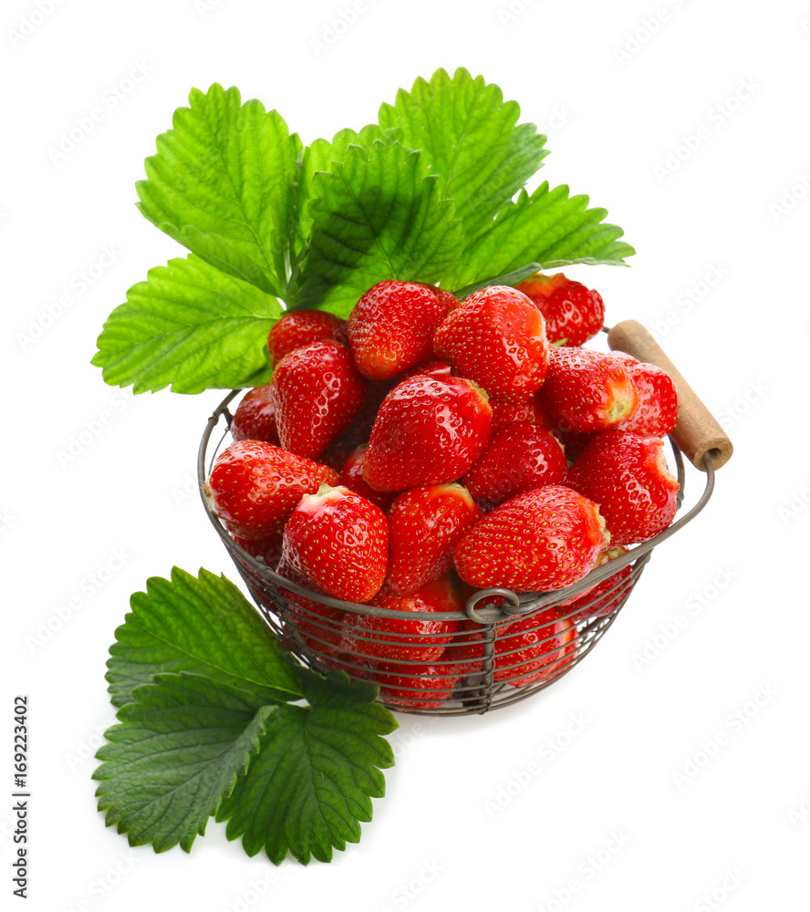 Basket with delicious perfect strawberry and leaves on white background