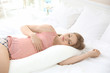 © Africa Studio - Beautiful pregnant woman sleeping with body pillow