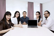© Creativa Images - Business people with blank screen on the laptop