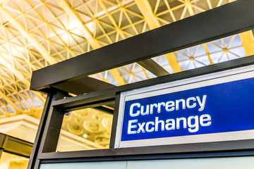 Closeup of currency exchange sign inside building