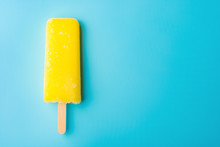 Yellow Popsicle On A Blue Background