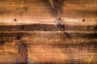 Old, scratched wooden plate as a background, wood texture