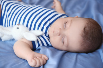 Wall Mural - Cute little baby sleeping on bed