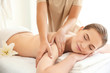 © Africa Studio - Young beautiful woman having massage in spa salon