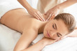 canvas print picture - Young beautiful woman having massage in spa salon