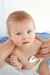 © Africa Studio - Doctor examining baby patient with stethoscope