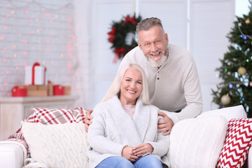 Sticker - Happy senior couple resting at home on Christmas eve