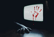 Bloody hand on TV screen as in a horror movie
