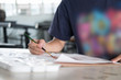 © 88studio - artist painting picture on paper at studio. woman holding brush in art workshop. creativity, hobby concept