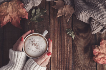 Hot coffee and autumn leaves