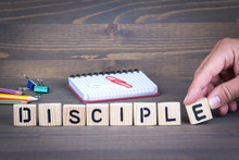 Disciple From Wooden Letters On Dark Texture Background