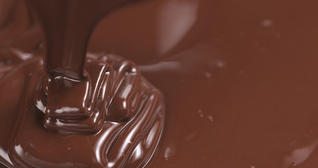 pouring melted premium dark chocolate