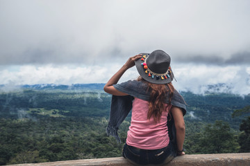 Asian women travel relax in the holiday. Take a scenic ride on the mountain. Thailand