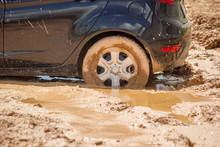 Car Tire Stuck In The Mud Background.