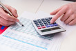 © Elnur - Finance analyst looking and financial reports