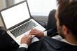 © Proxima Studio - Businessman using laptop at home