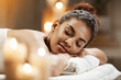 © Cookie Studio - Beautiful african girl resting relaxing in spa resort with closed eyes.