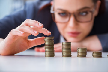 Businesswoman with coins in forex concept