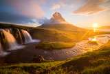 Fototapeta Góry - Summer sunrise on famous Kirkjufellsfoss Waterfall and Kirkjufell mountain in Iceland