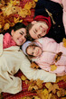 Happy family in autumn in the park.