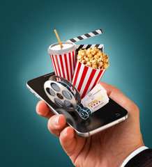 Wall Mural - Smartphone application for online buying and booking cinema tickets. Live watching movies and video. Unusual 3D illustration of popcorn, cinema reel, disposable cup, clapper and tickets on smarthone