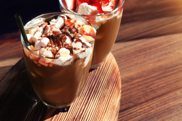 Wall Mural - Dessert with cold brew coffee in glasses on wooden table