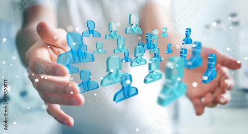 Fotomural Businessman holding 3D rendering group of blue people