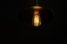Retro Light Bulb Hanging With Dark Space Background For Your Decoration, Concept Of Creativity
