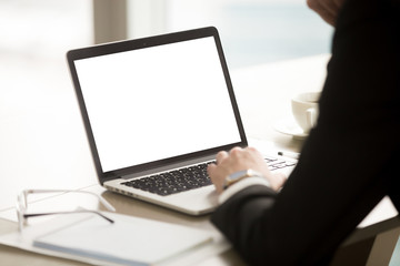 businessman wearing suit using pc laptop with mock up white blank screen, copy space for text, adver