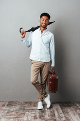 Poster - Full length portrait of a happy young african man